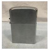 Lighter. 7 inches tall.