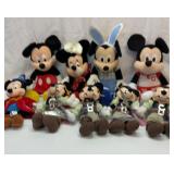 Group of Mickey and Minnie Mouse plushes