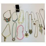 12 necklaces and a pair of earrings