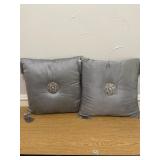 Two silver fabric pillows w/ tassel ends.  Will ne