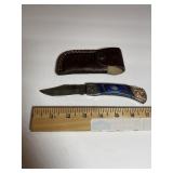 Ornate Damascus-Pattern Folding Knife ï¿½ Blue Hands