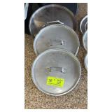 Three assorted medium size pot lids