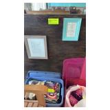Two picture frames with signs