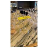 Large lot of assorted glass stemware on bar