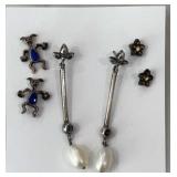 Silvertone pierced earrings, some need