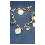 14k Gold Bracelet w/14K,18k & Gold Tone Charms.