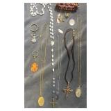 Religious necklaces, rosaries, pins & more