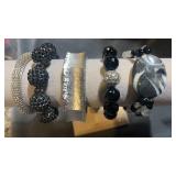 Silver and black bracelets