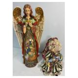 Angel figurine and Santa candle holder