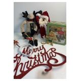 Various items with merry Christmas sign and tin