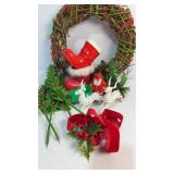 Vintage Christmas wreath decor and figurines.
