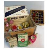 Vintage ornaments in cigar box and lights