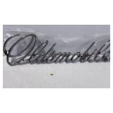 Oldsmobile Chrome Cursive Script Emblem