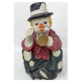 Seated Clown Playing Horn