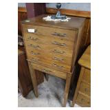 six drawer silver chest on stand with crushed red