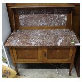 Marble top two door cabinet on wheels with inlaid