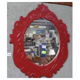 Ornately carved frame mirror
