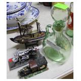 Green glass decanter, wooden ship model, Harley Da