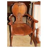 Vintage oak arm chairHi domed cut out back,claw