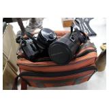 Canon AE-1 camera in case with flash