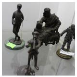 Four cast metal figures: Monkey, clown, seated in