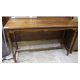 Entry table with carved skirting and turned legs