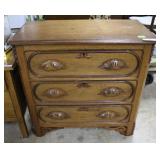 Three drawer dresser with ribbed sides, leaf key h