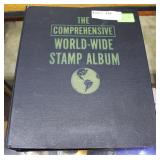 The Comprehensive World Wide stamp album partially