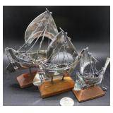 Trio gradated Asian sailing ships on stands