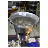 Champagne bucket loaded with unsorted change