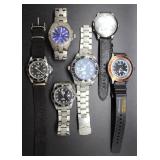 Six Invicta watches