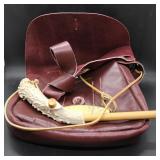 Leather satchel with antler powder measure