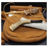 Leather satchel with black powder accessories