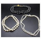 Three pearl necklaces: Black sea pearls, graduated
