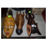 Three carved animal themed wooden plaques: Elephan