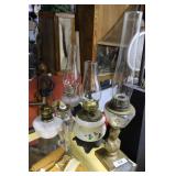 Four oil lamps: Lady bust, HP floral, clear glass