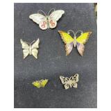 Five sterling and enamelware butterfly pins