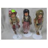 Three 20th Century Tourist dolls