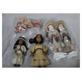 Five resin Native American and baby dolls