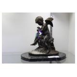 Cast cherub on marble base after Charles Lemire