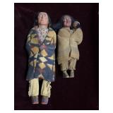 Two Native American paper mache faced dolls