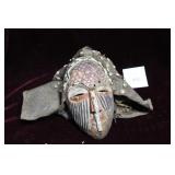 Carved African mask with beadwork
