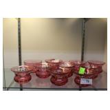 Nine cranberry thumb print bowls