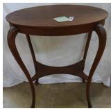 Oak quarter sawn oval table, carved curved legs,