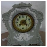 Wedge wood mantle clock, clock face has brass