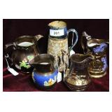 Four copper luster pitchers & Doulton Lambeth