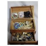 Two wooden jewelry boxes loaded with costume