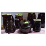6 pcs. Glazed brownware crockery, 5 pitchers,