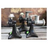 Three vintage meat grinders in assorted condition