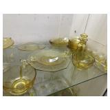 Shelf grouping yellow depression glass: footed
